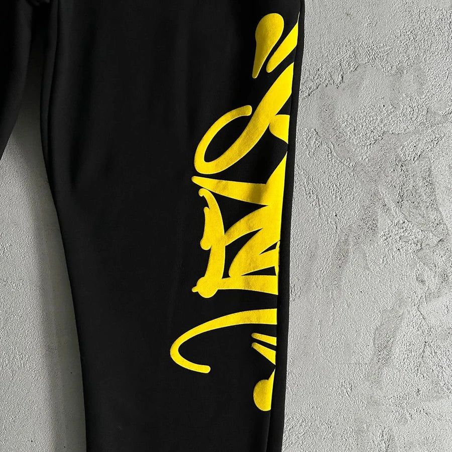 SYNAWORLD TEAM SYNA TRACKSUIT - MARL YELLOW/BLACK