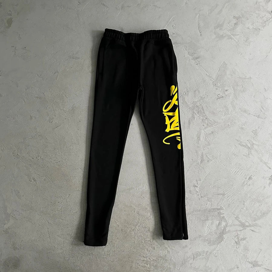 SYNAWORLD TEAM SYNA TRACKSUIT - MARL YELLOW/BLACK